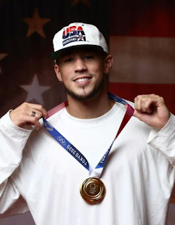 Picture of Devin Booker with the medal