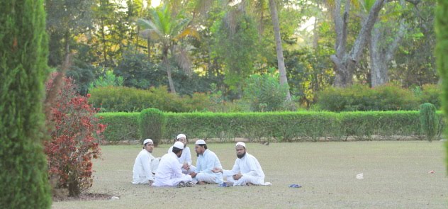 Locals having a chat on the Gumbaz gardens, Srirangapatna