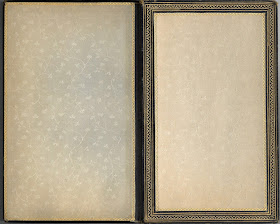 Flyleaf and paste down of book. hey are a pale cream colted silk with a floral pattern.
