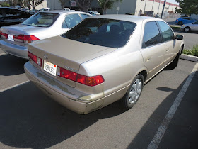 Faded and peeling paint on Toyota Camry.