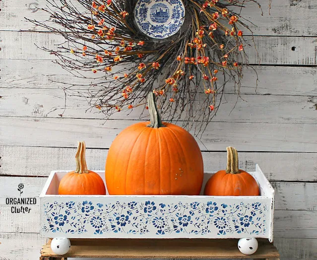 Photo of white drawer stenciled with blue flowers