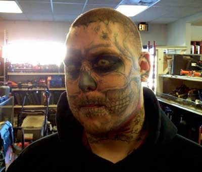 Skull face TNT tattoo