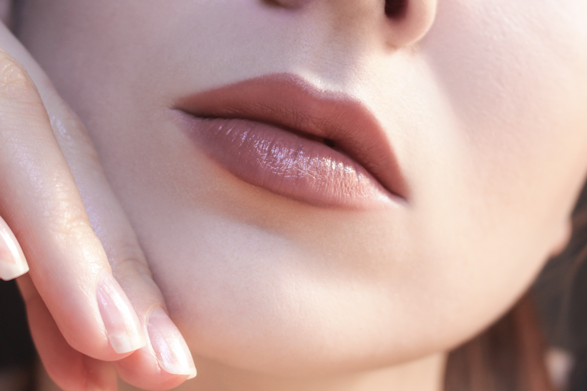 close-up picture of Liz Breygel's lips with a nude, natural makeup look