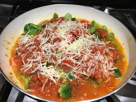 broccoli and Parmesan cheese in a skillet