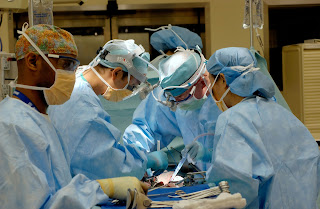 surgeons operating in a theatre