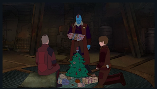 Cartoon version of a young Peter Quill and Kraglin sitting around a Christmas tree. Yondu is standing over them while holding a present and looking disgusted.