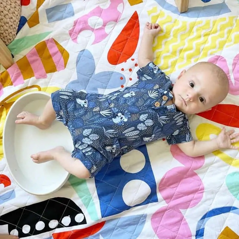 baby playing in water.