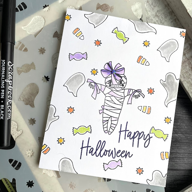 Halloween Mummy and Treats card created with: Scrapbook.com ghostly treats stencil, boo-tiful stamp set, journaling pen; Tim Holtz distress ink in fossilized amber twisted citron wilted violet crackling campfire and hickory smoke; Pinkfresh jewels