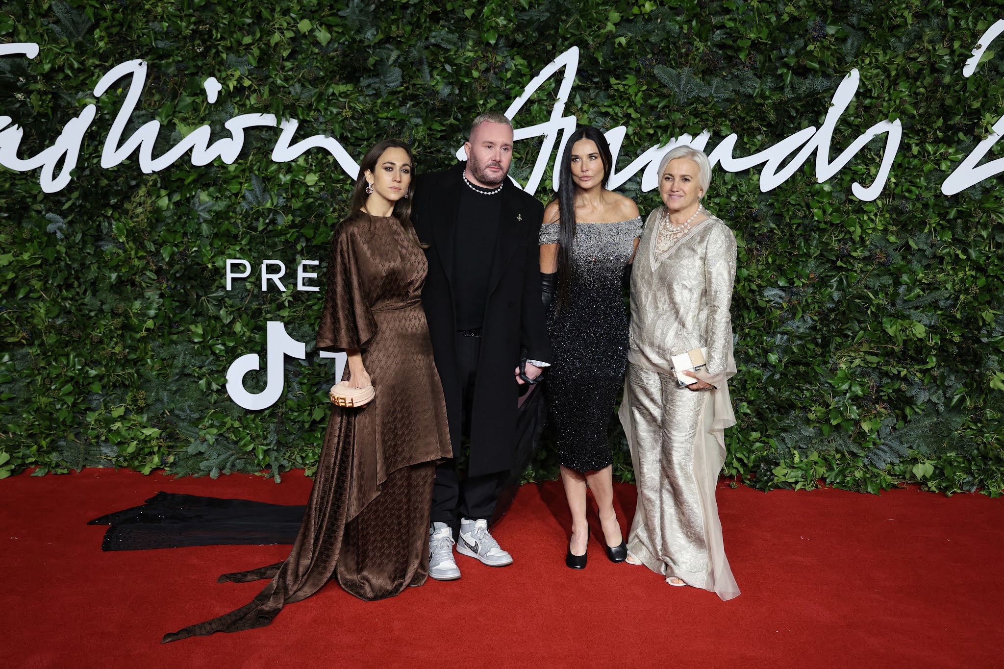 Delfina Delettrez Fendi, Kim Jones, Demi Moore and Silvia Venturini Fendi at The Fashion Awards 2021 red carpert