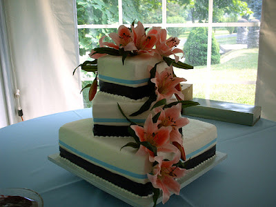 So do this cake The cake looks nature fresh with pink lilies green 