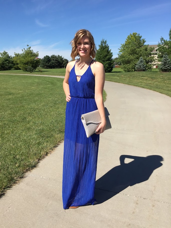 A cobalt blue maxi dress with cutouts for a subtly sexy evening look. 