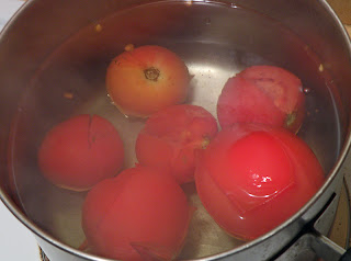 Tomatoes in Boiling Water with Skin Loose