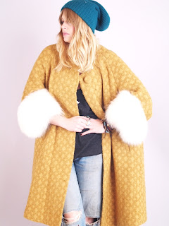 Vintage 1960's mustard colored wool swing coat with white fox fur collar and cuffs.