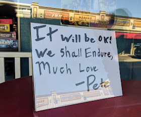 sign on the window at Pete's Emporium on Main St