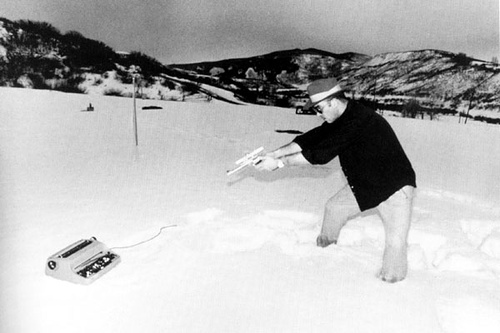 Hunter S. Thompson shooting his typewriter