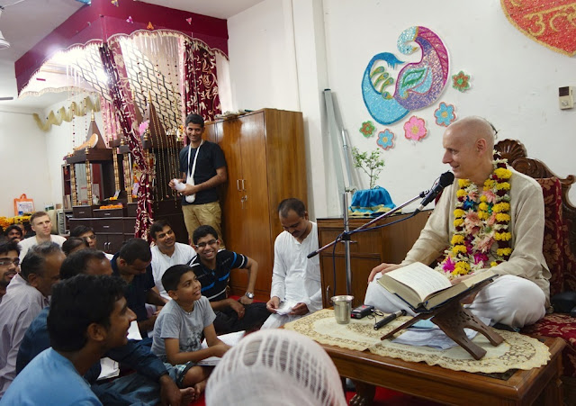 Sankarshan Das Speaking with a Small Child at BACE Lecture