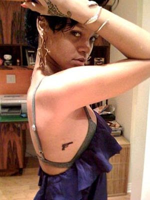 Rihanna new guns tattoo