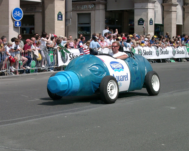 Bottle-shaped car of the Tour de France publicity caravan, Rue de Rivoli, Paris