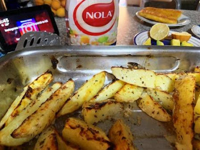 Baked potatoes with NOLA Mayonnaise sauce, and fish in background