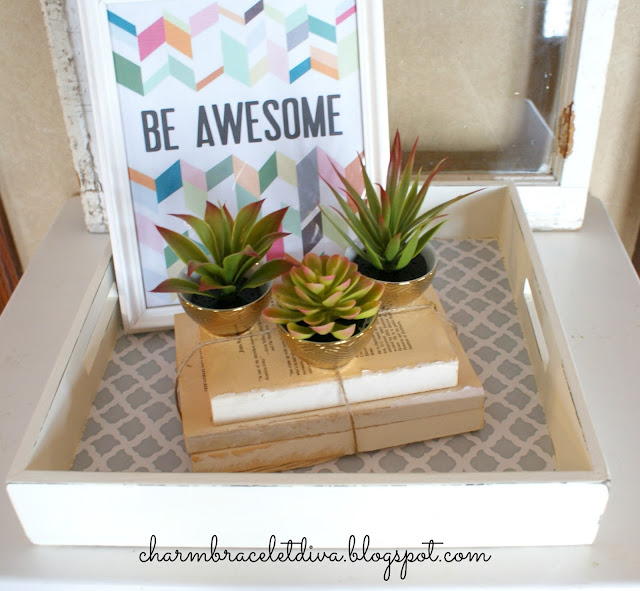 Store cacti in Target golden bowls on book bundles on quatrefoil tray