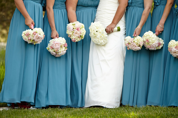 The bridesmaids carried bouquets of hydrangea pink peonies and ranunculus