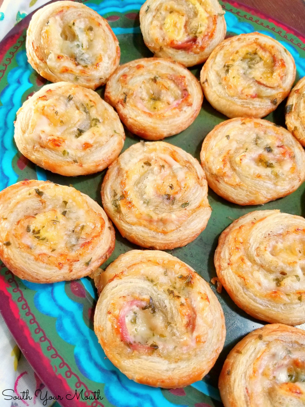 Ham & Swiss Party Pinwheels! A super easy appetizer recipe using puff pastry, ham and cheese that's perfect for entertaining!