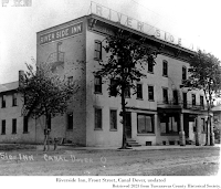 Black & white photograph, exterior Riverside Inn, Front Street, Canal Dover, undated. Retrieved 2023 from Tuscarawas County Historical Society.