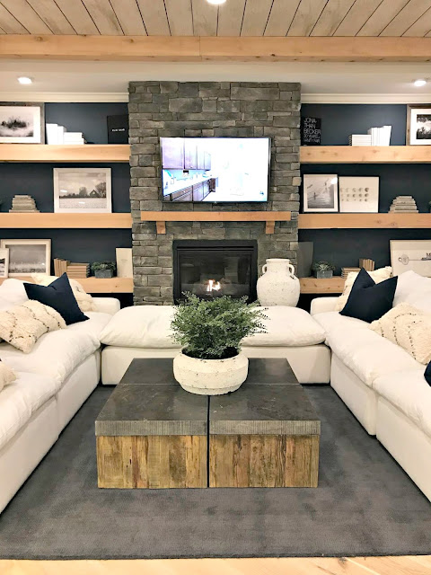 Dark blue walls with chunky shelves