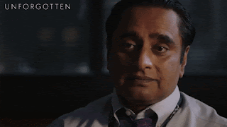 Sanjeev Bhaskar in the role of Sunny Khan, slightly shakes his head wearily towards whoever is speaking out of shot.