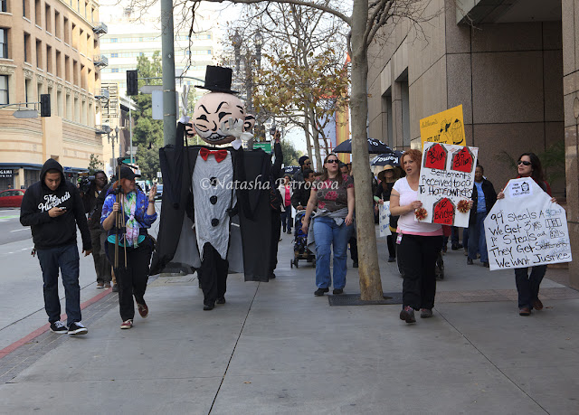 occupy fights foreclosure, giant Monopoly man, protest, eviction, march, occupy our homes