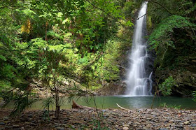 Hira Taki waterfall, rocks in foreground,jungle