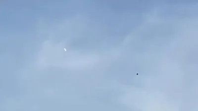 2 UFOs filmed over Glasgow Scotland UK and seen by Scottish helicopter pilot.