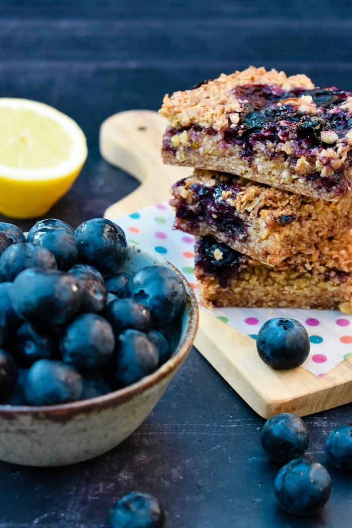 Easy blueberry and lemon oaty breakfast bars. These delicious oaty bars or flapjacks as they are known in Scotland, are perfect for breakfast on the go or a mid-morning or afternoon energy boost. Suitable for vegetarians and vegans.