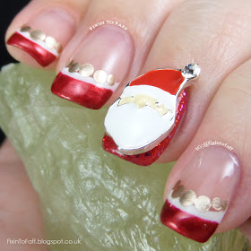 Santa Claus French Tip nail art with nail charm.