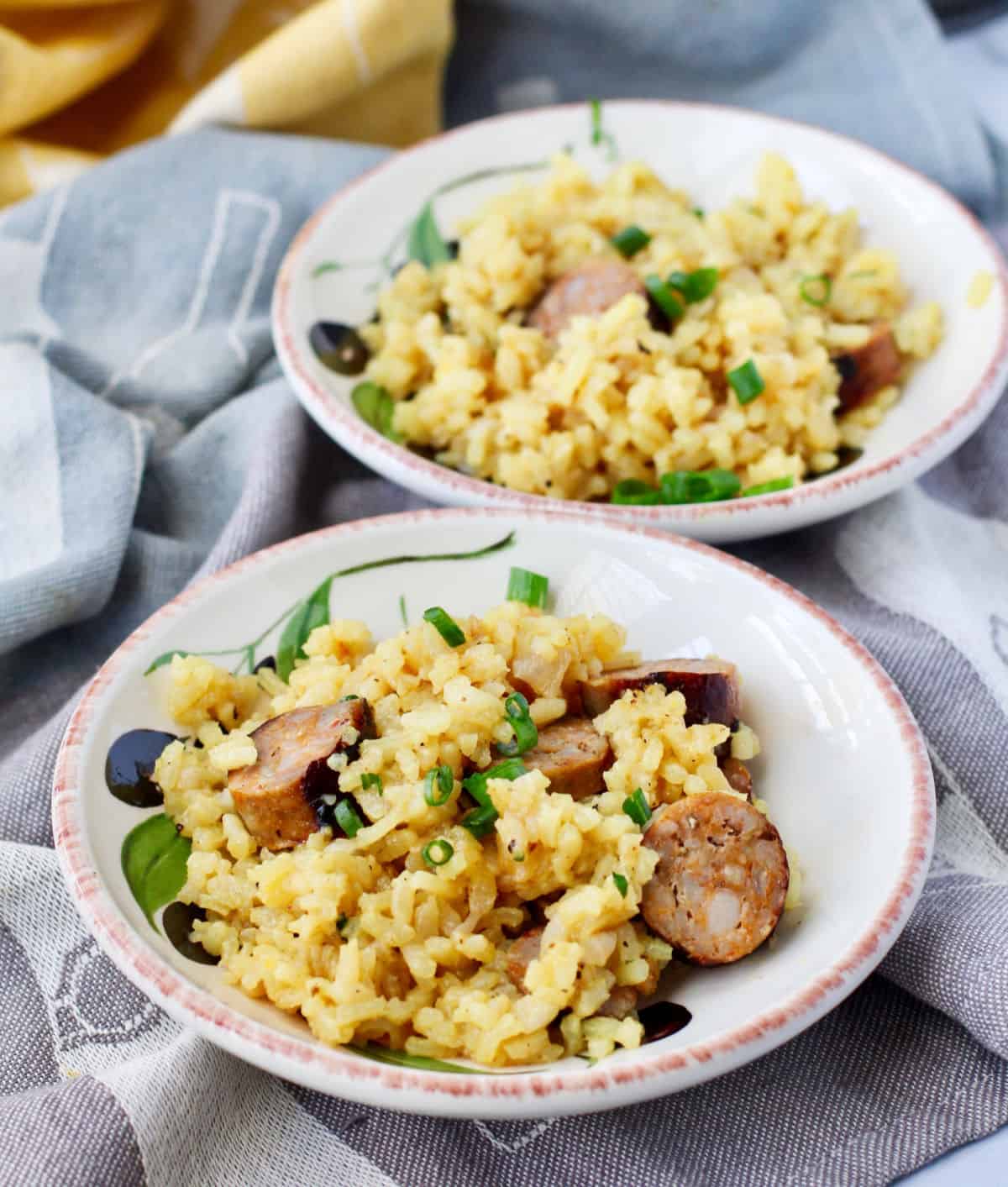 Saffron Risotto with Sausage in individual bowls.