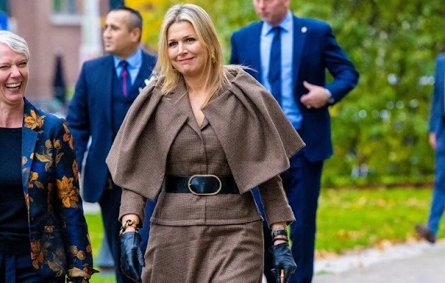 Queen Maxima wore a new outfit by Natan. Gianvito Rossi Laura leather knee-high boots. Susan Gail bag