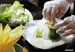 Stuffing and rolling the fresh spring roll