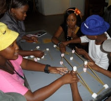 Making a bridge out of spaghetti and marshmallows
