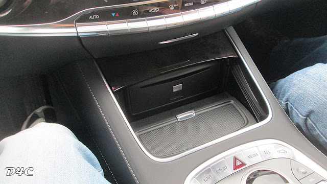 The 2014 Mercedes S500 - some storage space below the cental console.