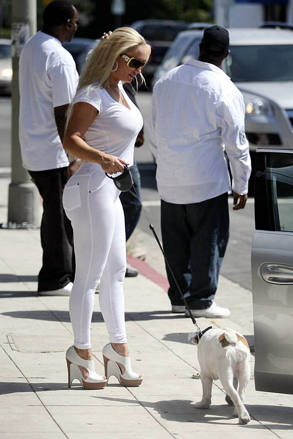 CoCo Austin in Tight White Outfit taking her little Doggy for a Walk