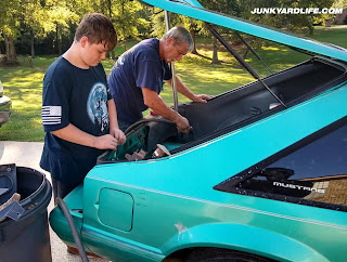 CJ and Darrell work on interior details of the 1993 Mustang.