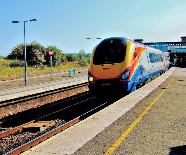 photo of diesel electric multiple unit class 222001 in east midlands train livery through wellingborough 2011