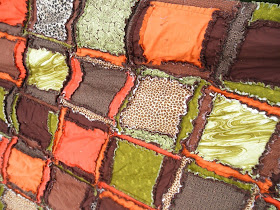 queen size rag quilt comes in orange, green, leopard print, and brown