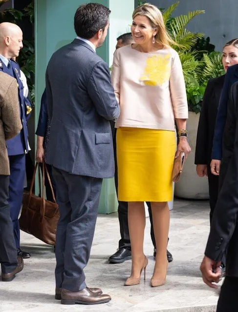 Queen Maxima wore a beige silk satin top by Natan, and a yellow satin skirt by Natan. Spring Summer 2018 collection