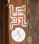 Hindu swastika painted on a door. Stone Town, Zanzibar, Tanzania.