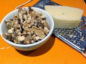 bowl of walnuts and Parmesan cheese