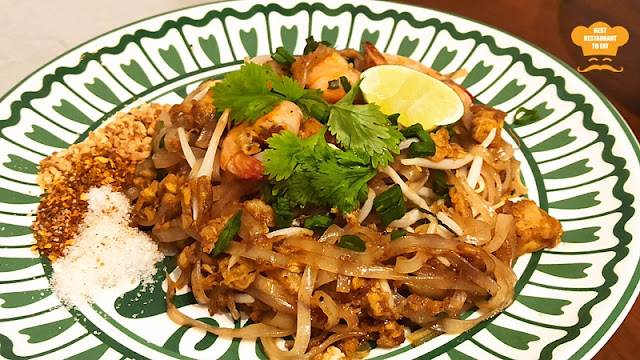 Thai Street Food - Phad Thai - Thai stir-fried rice noodles with prawns