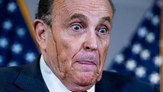 Rudy Giuliani, Attorney for president Trump with hair dye running down his cheek