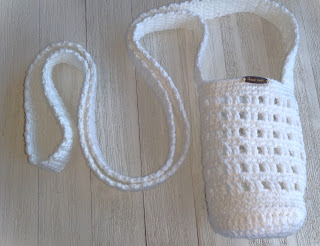 Crochet water bottle holder with a long strap