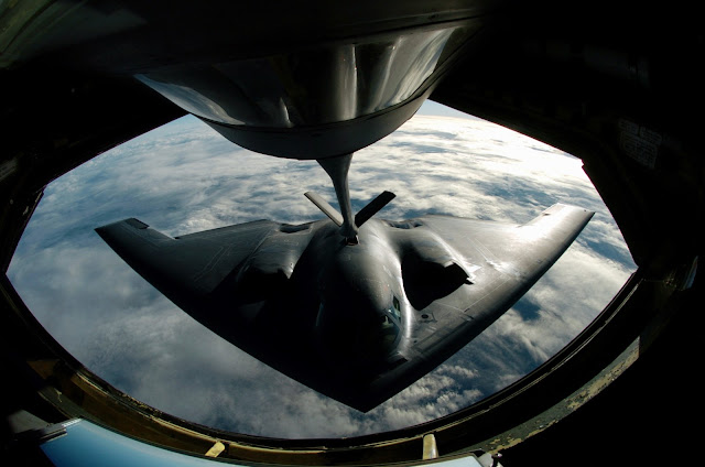 A B-2 Spirit bomber refuels from a KC-135 Stratotanker